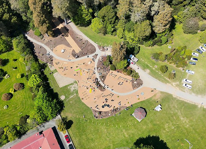 Aerial view of Faulkner Bush Scenic Reserve playspace showing natural play zones, paths, and surrounding trees