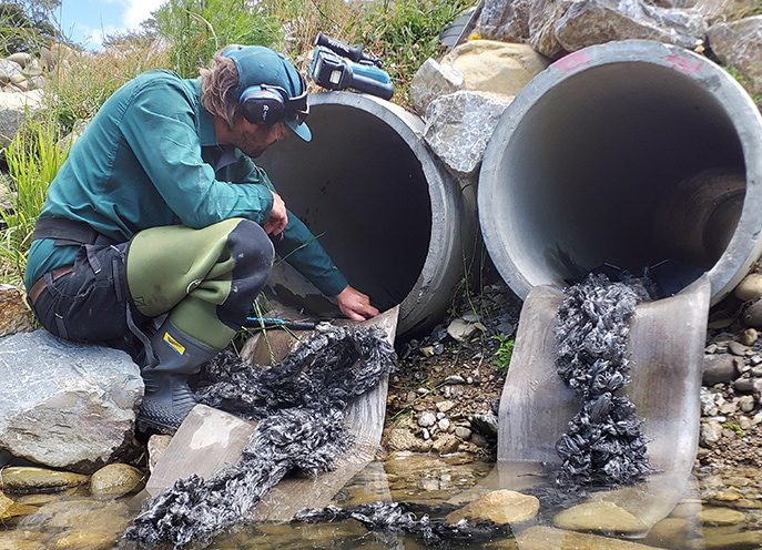 Close-up of fish passage material installed at the outlet of a concrete culvert