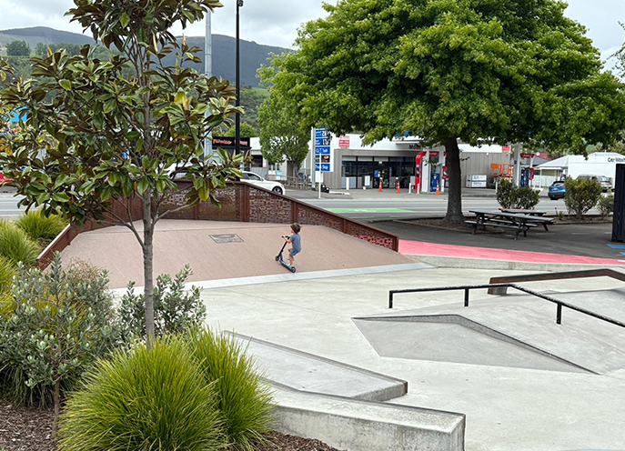 Little kid on a scooter at the Stoke Youth Park