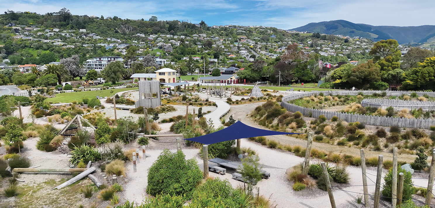 Elevated view showing winding paths, planting zones and play areas across Te Pā Harakeke